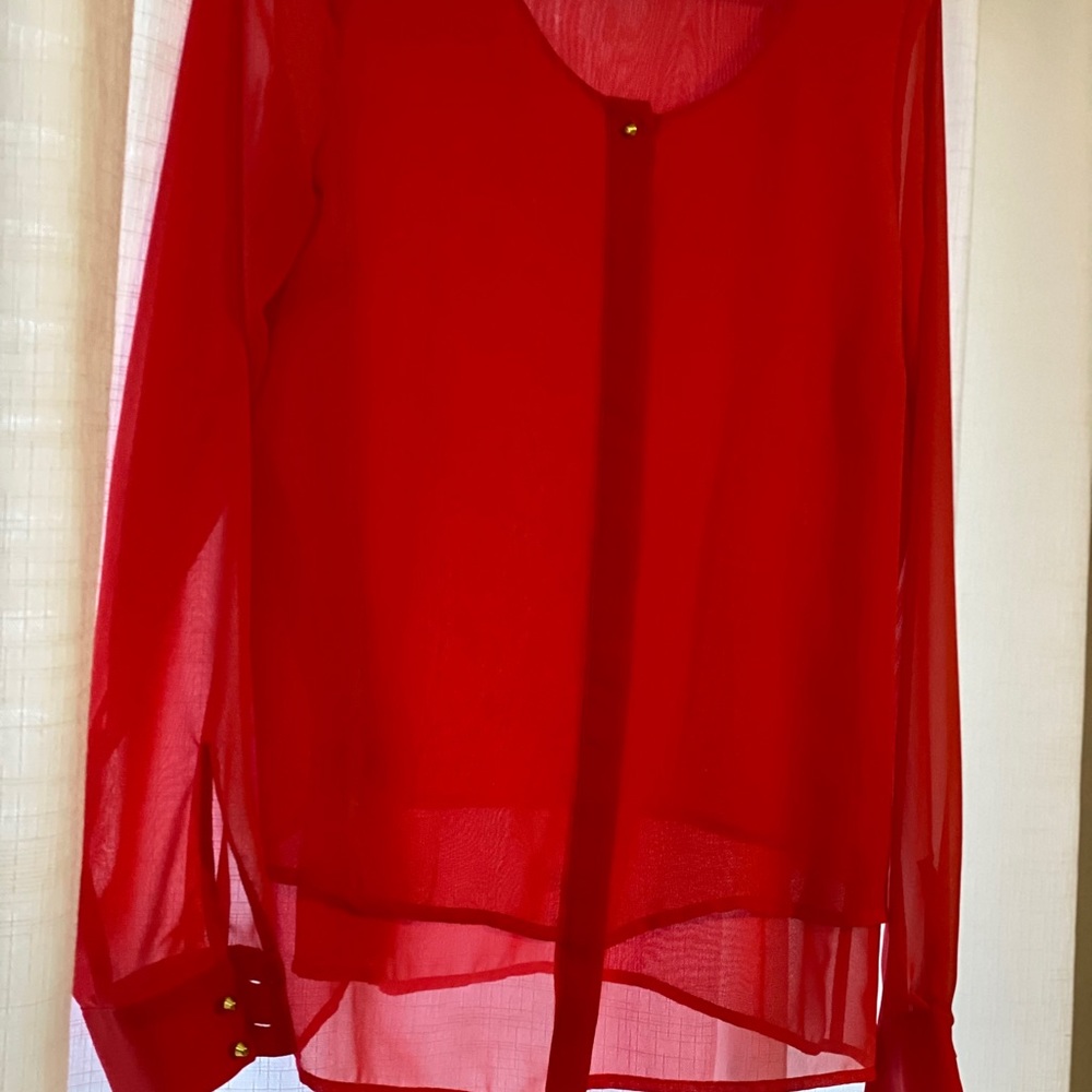 Woman’s bright pink blouse
